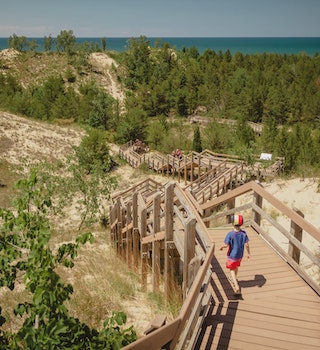 Boy hiking along dune succession trail in Indiana Dunes National Park
